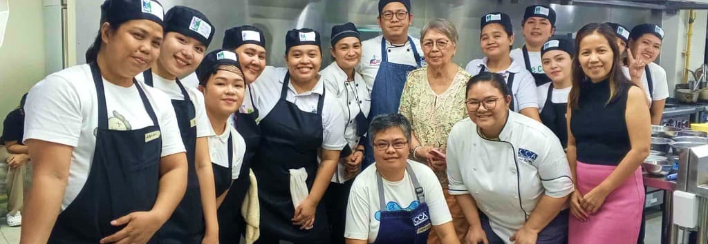 CELI scholars and partners gathered together in the kitchen