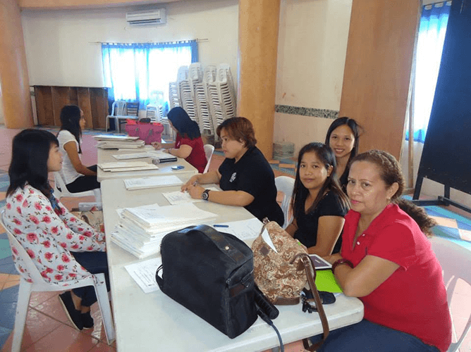 A City of Candon workshop around a shared table