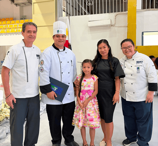 CCA Manila chefs with a graduate and her family