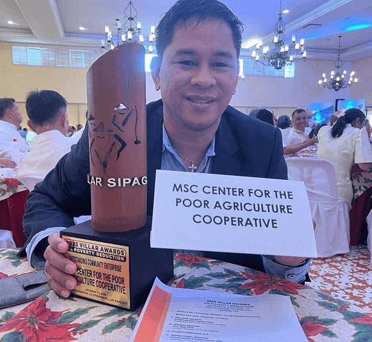 MSC Center for the Poor Agriculture Cooperative with the Villar Awards trophy
