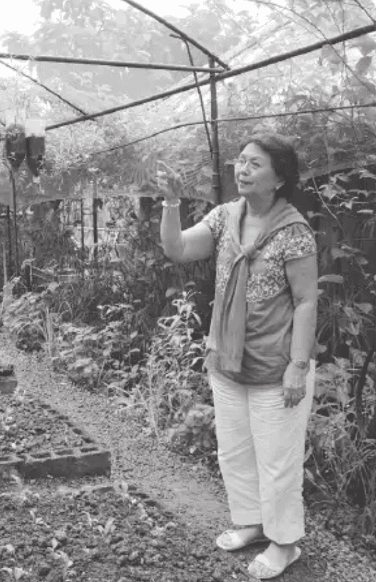 Susana P. Guerrero standing in a garden